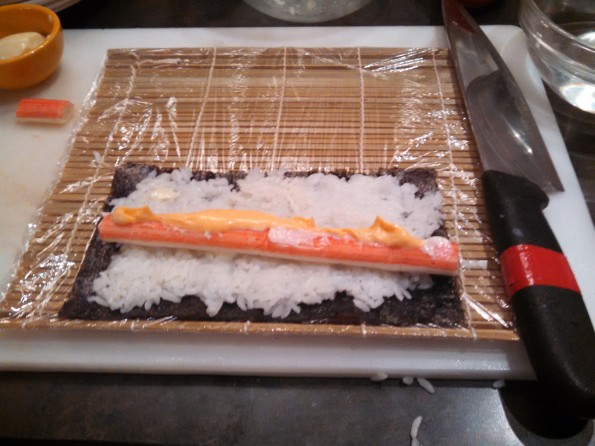 Preparing to make maki - cut sushi rolls